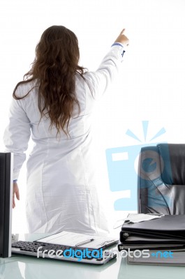 Back Pose Of Young Doctor Stock Photo