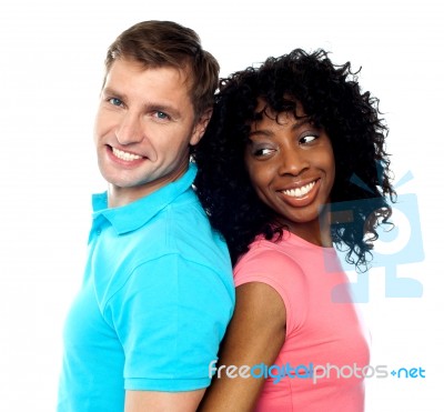 Back To Back Young Couple Stock Photo