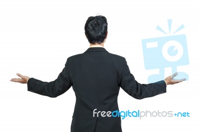 Back View Of Businessman Behind And Presenting Stock Photo