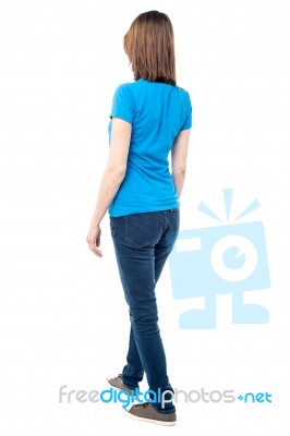 Back View Of Walking Casual Woman Stock Photo