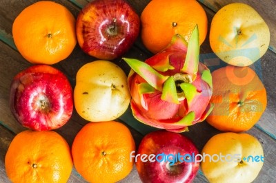 Background Of Fruits On The Wooden Stock Photo