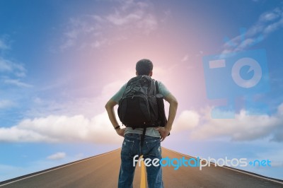Backpacker Standing On The Road Stock Photo