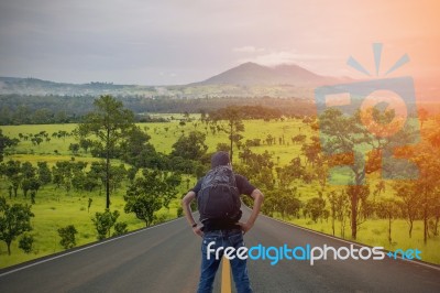 Backpacker Standing On The Road Stock Photo