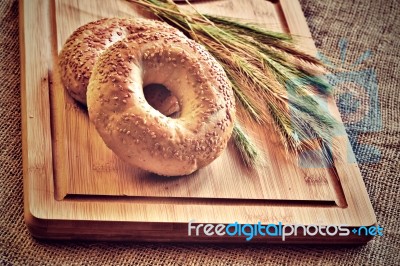 Bagels On Bread Board Stock Photo