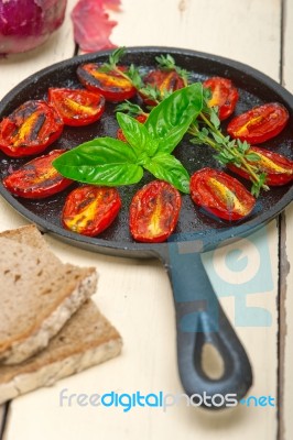 Baked Cherry Tomatoes With Basil And Thyme Stock Photo