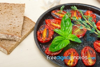 Baked Cherry Tomatoes With Basil And Thyme Stock Photo