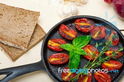 Baked Cherry Tomatoes With Basil And Thyme Stock Photo