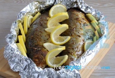 Baked Herring In Spices And Herbs In Foil Stock Photo