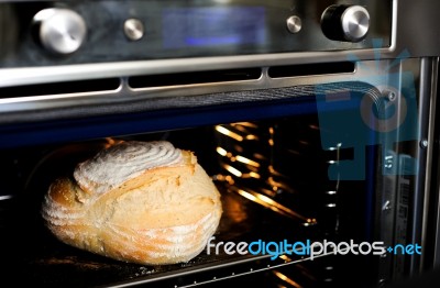 baking dough in oven Stock Photo