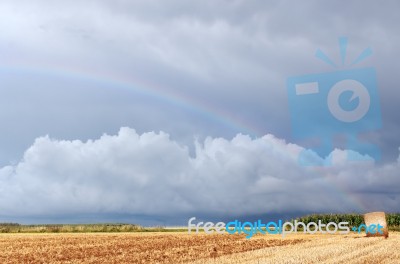 Bale Of Hay And Rainbow Stock Photo