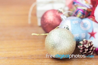 Balls And Gift On Wooden Stock Photo