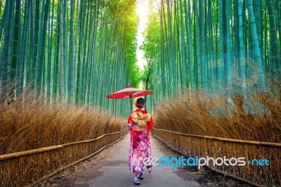 Bamboo Forest. Asian Woman Wearing Japanese Traditional Kimono At Bamboo Forest In Kyoto, Japan Stock Photo