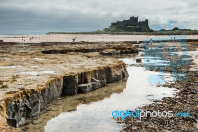 Bamburgh, Northumberland/uk - August 15 : Shoreline View To Bamb… Stock Photo