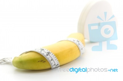 Banana And Measuring Tape Stock Photo