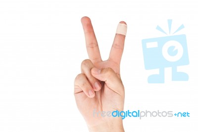 Bandage Finger with victory sign Stock Photo