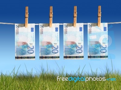 Banknotes Hanging On Laundry Line Stock Photo