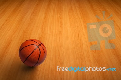 Basketball On Wooden Floor Stock Photo