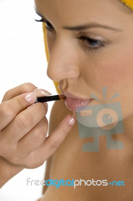 Beautician Putting Lipstick On Female's Lips Stock Photo