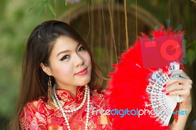 Beautiful Asian Girl With Chinese Traditional Dress Cheongsam Stock Photo