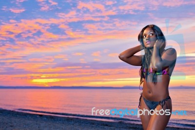 Beautiful Black African American Woman Posing On The Beach At Su… Stock Photo
