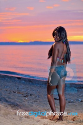 Beautiful Black African American Woman Posing On The Beach At Su… Stock Photo