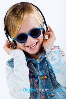 Beautiful Child Listening To Music With Digital Tablet Stock Photo
