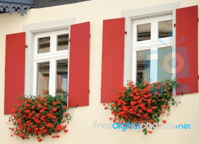 Beautiful Flower Baskets Beneath Windows In Rothenburg Stock Photo