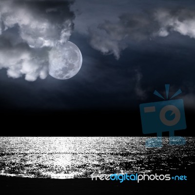 Beautiful Full Moon Behind Cloud Stock Photo