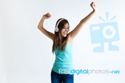 Beautiful Girl Dancing And Listening To Music. Isolated On White… Stock Photo