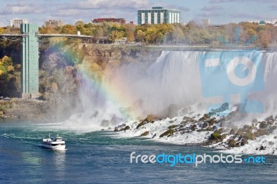 Beautiful Image With Amazing Niagara Waterfall, Rainbow, And A Ship Stock Photo