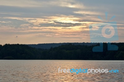 Beautiful Isolated Image With The Lake And The Forest On The Sunset Stock Photo