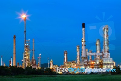 Beautiful Lighting Of Oil Refinery Palnt Against Dusky Blue Sky Stock Photo