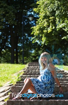 Beautiful Pregnant Woman In City Park Stock Photo