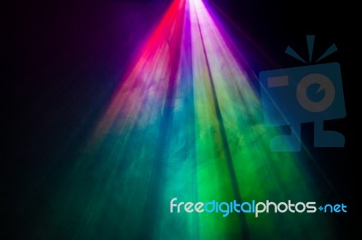 Beautiful Rainbow Color Wide Lens Projector With Light Beam For Movie And Cinema At Night . Smoke Texture Spotlight . Screening For Multimedia . Black Background  Stock Photo