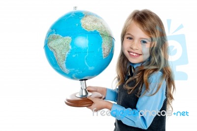 Beautiful School Going Kid Holding Globe Stock Photo