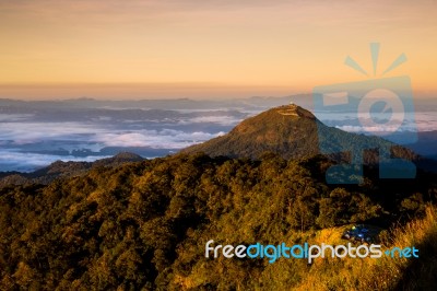 Beautiful Sun Rise On Top Mountain With Could And Camping Area Stock Photo