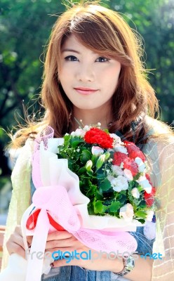 Beautiful Woman Holding Bouquet Stock Photo