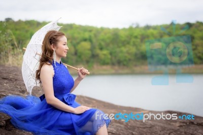 Beautiful Woman Wear Blue Evening Dress Hold White Umbrella Watc… Stock Photo