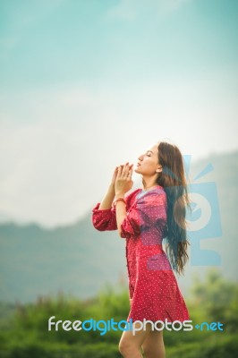 Beautiful Young Attractive  Asian Women In Red Dress On Sunrise Beautiful Nature Background Of The Mountains And Lotus Garden Image Of Happy  Camping, Travel, Lifestyle Resting , Relaxing Concept Vintage Style Stock Photo