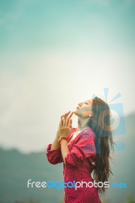 Beautiful Young Attractive  Asian Women In Red Dress On Sunrise Beautiful Nature Background Of The Mountains And Lotus Garden Image Of Happy  Camping, Travel, Lifestyle Resting , Relaxing Concept Vintage Style Stock Photo