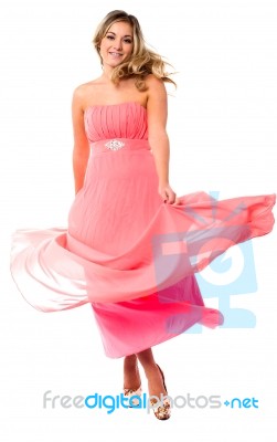 Beautiful Young In Fluttering Party Dress Stock Photo