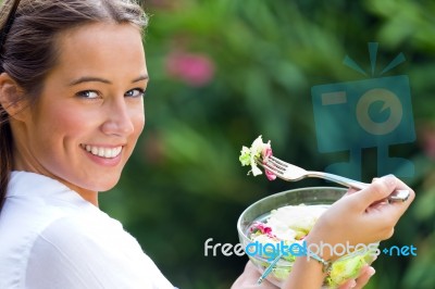 Beautiful Young Woman Holding Green Salad, Outdoors Stock Photo