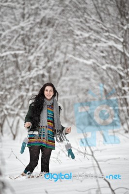 Beautiful Young Woman In A Sweater On A Winter Walk In A Wood Stock Photo