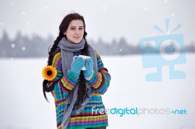 Beautiful Young Woman In A Sweater On A Winter Walk With A Cup O… Stock Photo