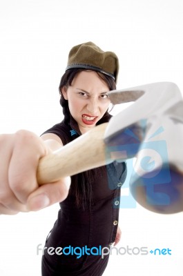Beautiful Young Woman Striking With Hammer Stock Photo