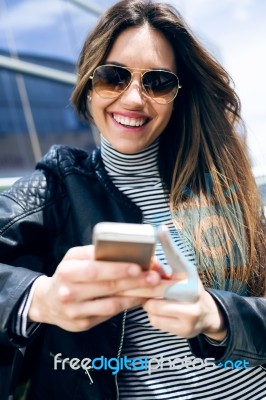 Beautiful Young Woman Using Her Mobile Phone In The Car Stock Photo