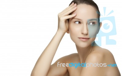 Beautiful Young Woman With Clean Skin Of The Face Stock Photo