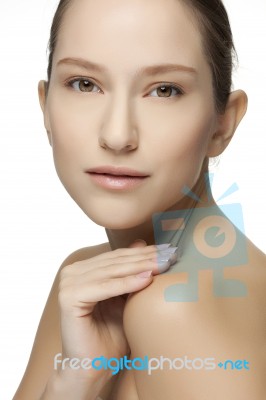 Beautiful Young Woman With Clean Skin Of The Face Stock Photo