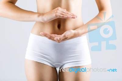 Beautiful Young Woman With Hands On Belly-stomach Ache Stock Photo