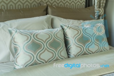 Bed And Pillows In Bedroom Stock Photo